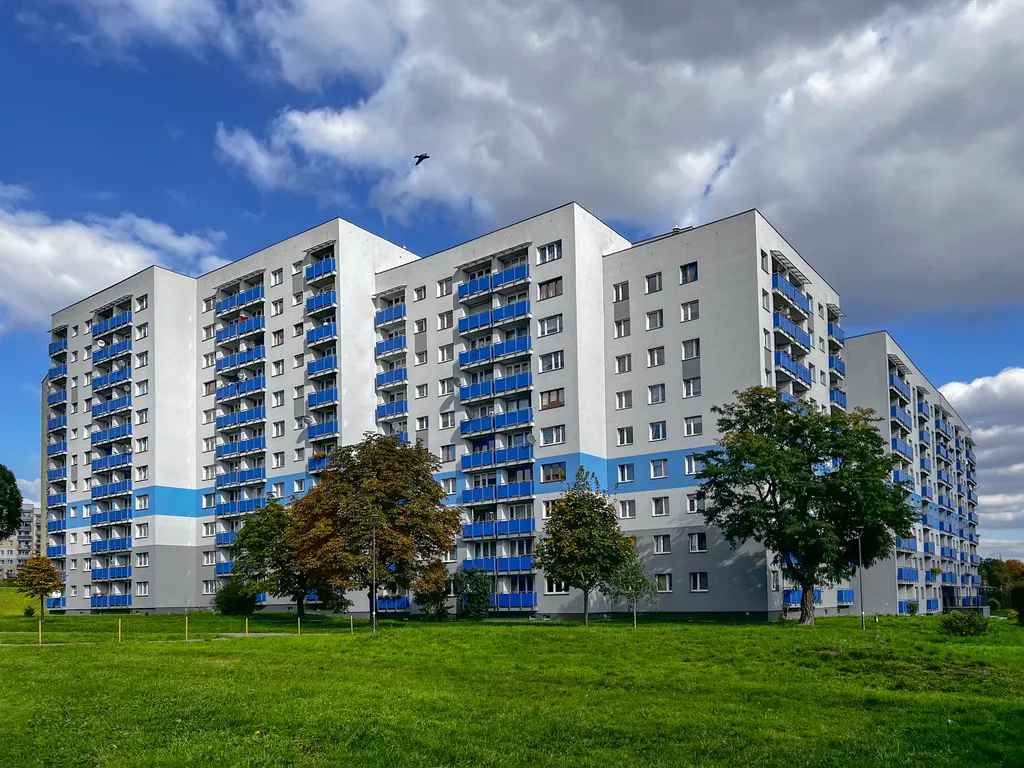 Apartment block with several satellite dishes mounted on the balconies